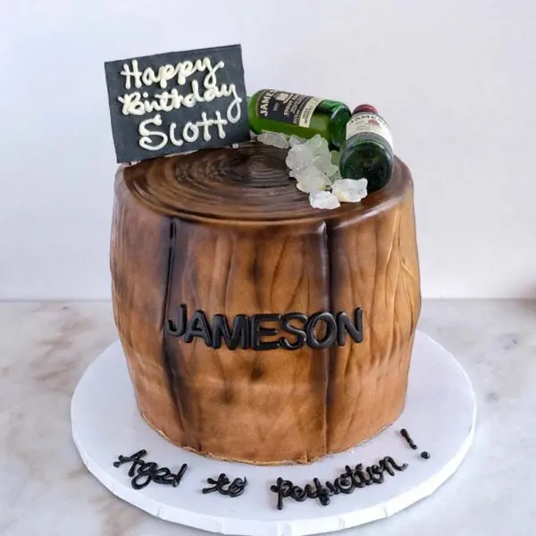 A cake with jameson whiskey on top of it.