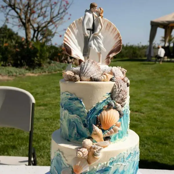 A cake with shells and seashells on top of it.