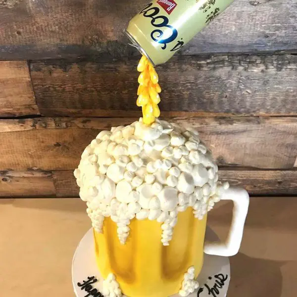 A cake that looks like a mug of beer.