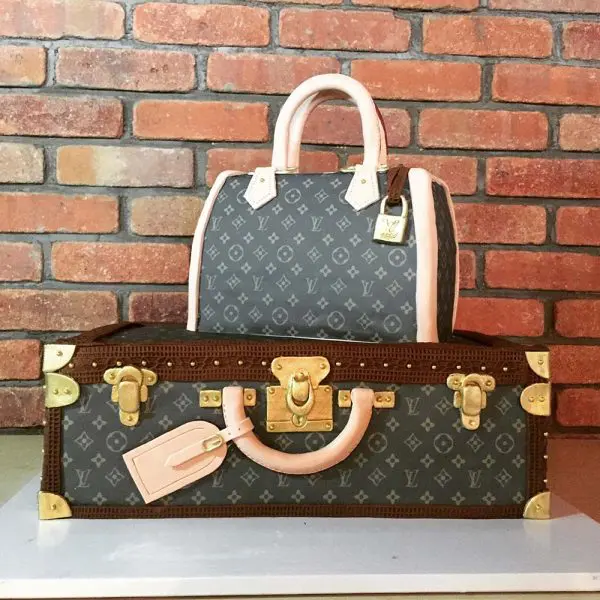 A louis vuitton bag and suitcase cake