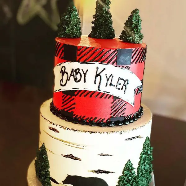 A cake with trees and bears on it.