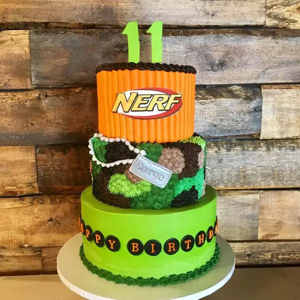 A cake that is made to look like a nerf gun.