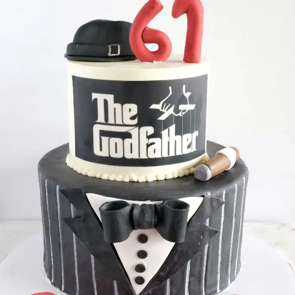 A cake that is shaped like the godfather.