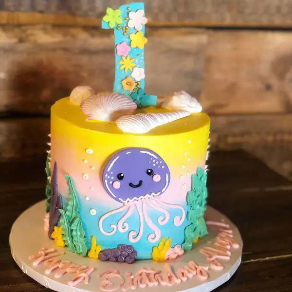 A birthday cake with an octopus on top of it.