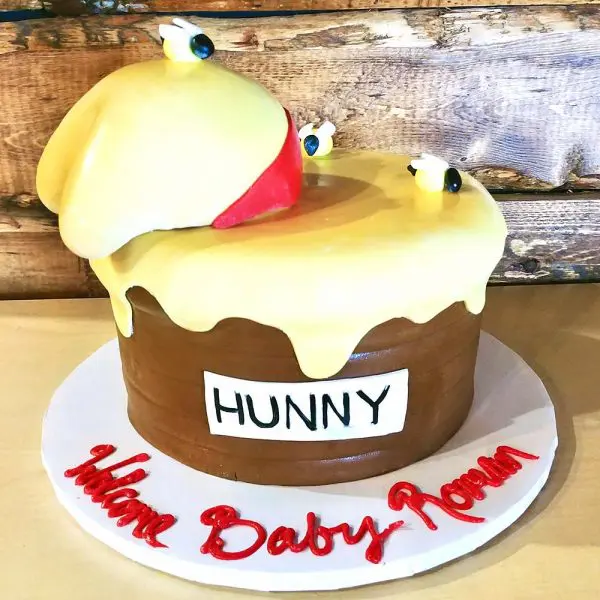 A cake with a bird on top of it